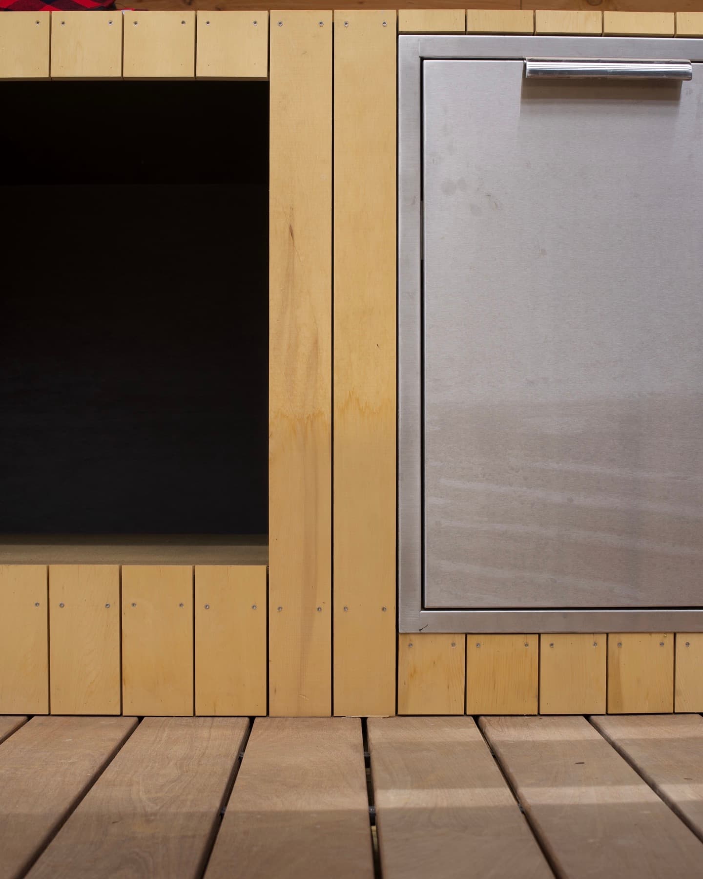 Close-up of crisp miter joints where white oak cabinet panels meet at a corner